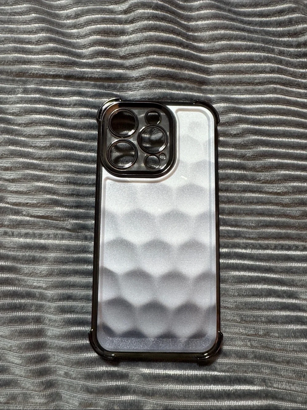 Sleek White Golf Ball Textured Phone Case with Black Trim for iPhone 15 Pro